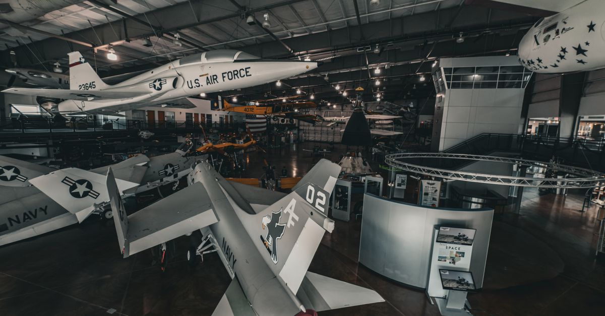 Interior view of an aviation museum showcasing historic aircraft displays.